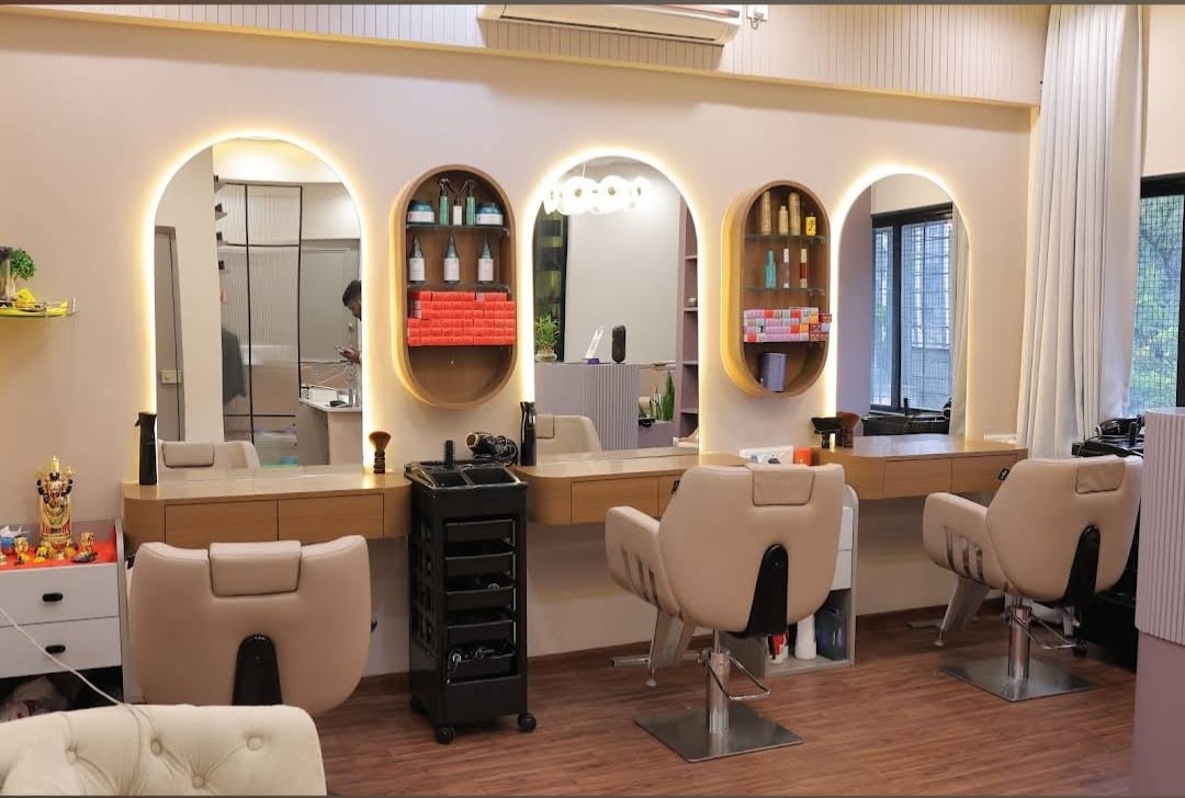 Styling stations with arched backlit mirrors at Marrbella Luxe Salon in Kothrud, Pune